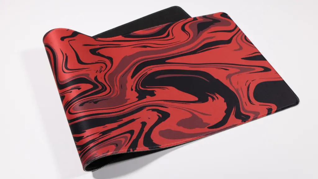 Red and black marble swirl gaming mouse pad with non-slip rubber base on white background